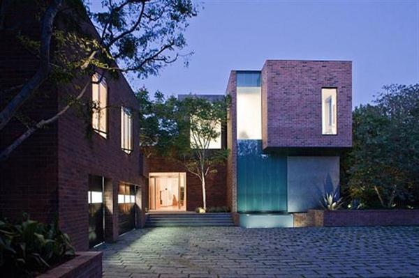 Beautiful and Modern Home Design by Assembledge with the Idea of Bricks Around the House