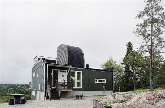 Swedish Style House Design with Black Wooden Exterior Rear view
