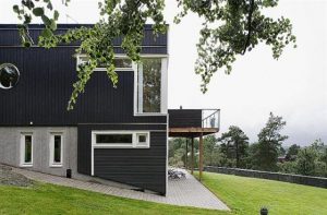 Swedish Style House Design with Black Wooden Exterior Side view