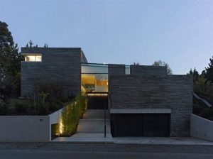 Two Story House Design With Rough Stone Facade Garage