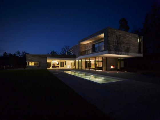Two Story House Design With Rough Stone Facade Night view