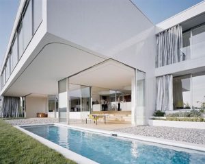 Elegant and Modern White Germany House Design Rear view with Pool