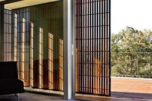 rustic rolling door on the Mosman House by Corben Architects